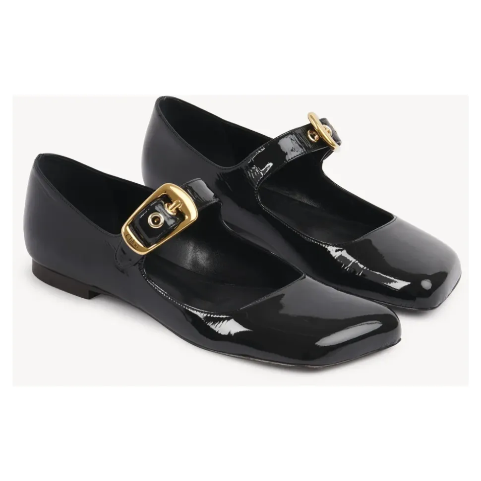 Schwarze Ballerinas mit übergroßer goldener Schnalle