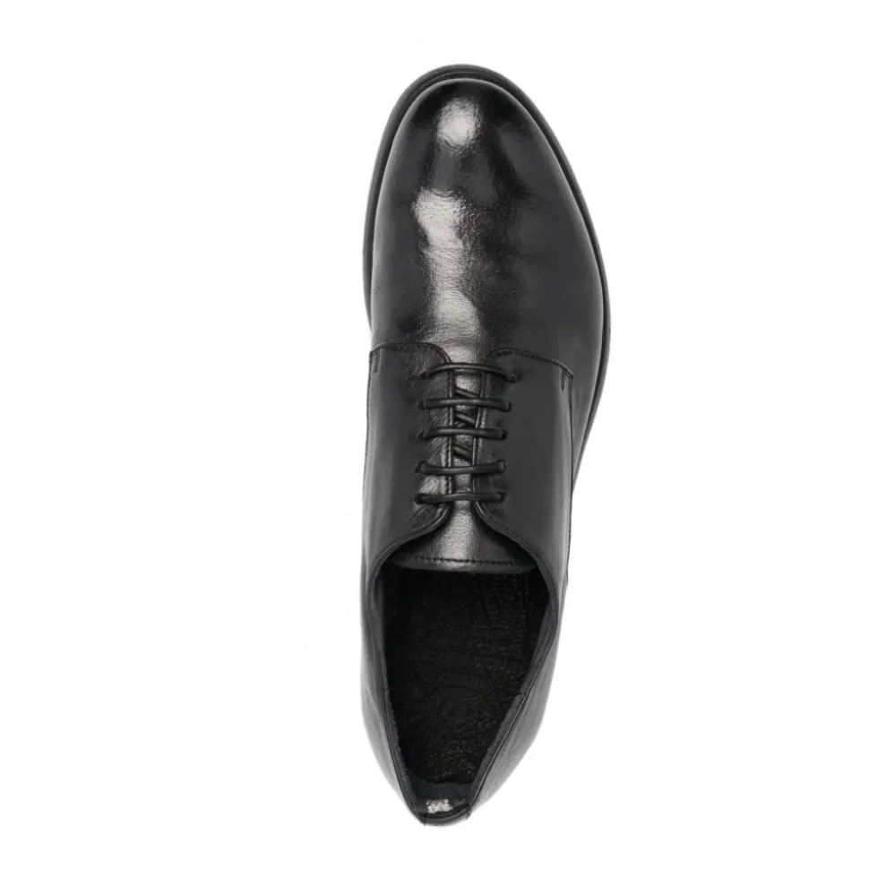 Schwarze flache Schuhe